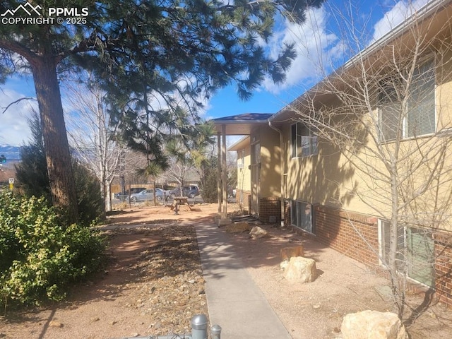 view of side of property with brick siding