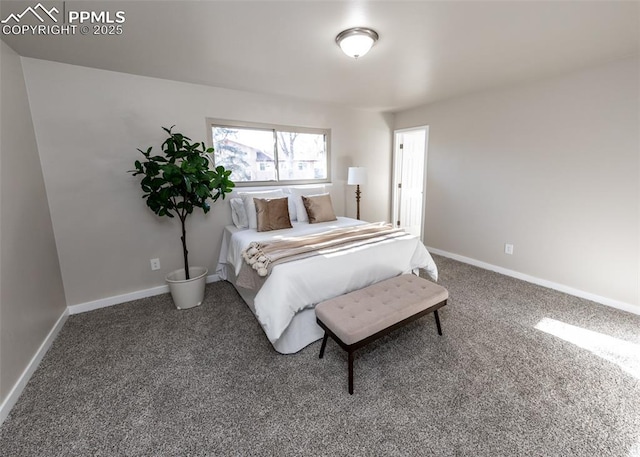 bedroom featuring carpet floors and baseboards