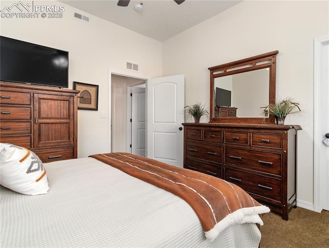 bedroom with baseboards, carpet flooring, visible vents, and a ceiling fan