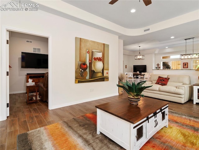 living area featuring recessed lighting, visible vents, ceiling fan, and wood finished floors