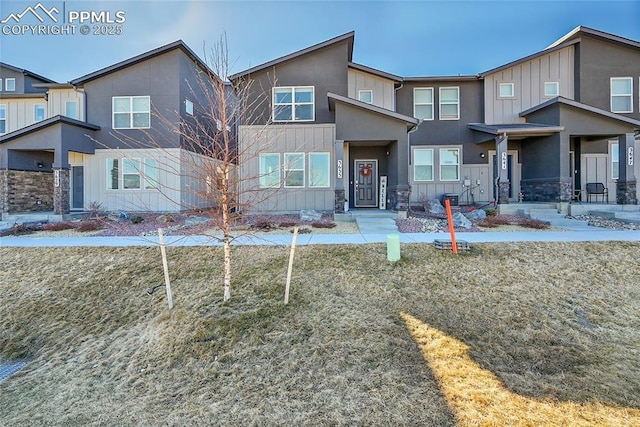 view of front of home with board and batten siding and stucco siding