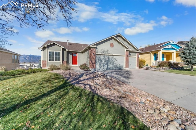 ranch-style house with a garage, concrete driveway, brick siding, and a front lawn