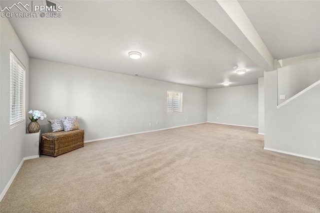 basement featuring carpet and baseboards