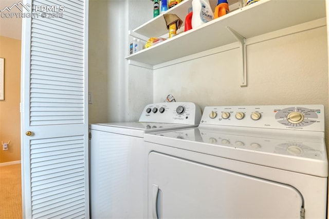 clothes washing area featuring laundry area and washer and dryer