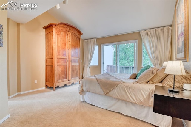 carpeted bedroom with access to outside and baseboards