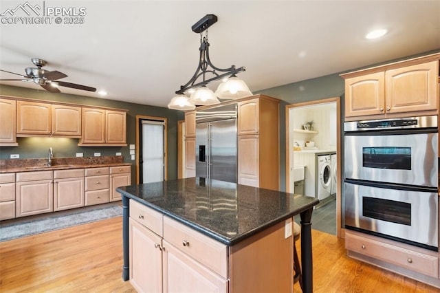 kitchen with appliances with stainless steel finishes, a sink, light brown cabinetry, ceiling fan, and recessed lighting
