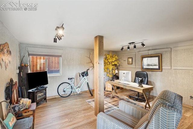 home office with wood finished floors