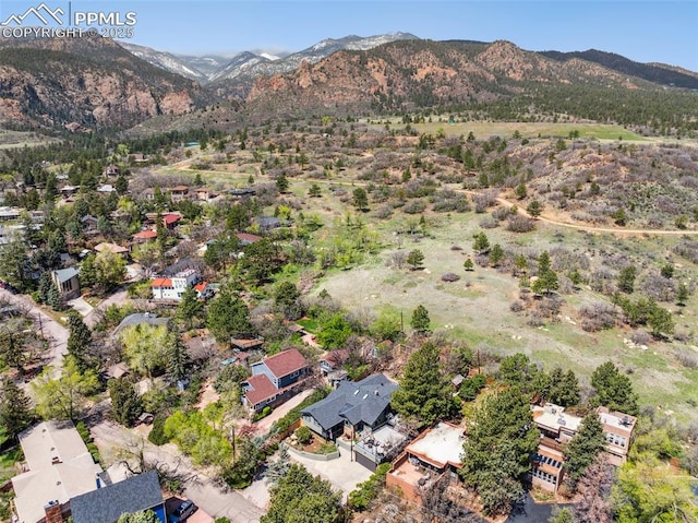 aerial view of residential area featuring a mountain backdrop