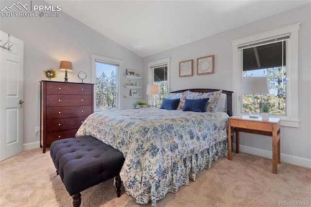 bedroom with lofted ceiling, carpet, multiple windows, and baseboards