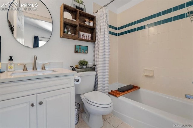 bathroom featuring toilet, vanity, shower / bath combo with shower curtain, and tile patterned floors