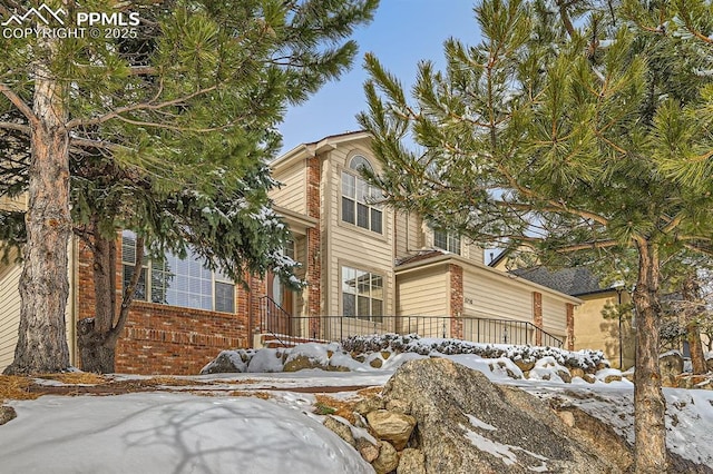 view of front of property featuring brick siding