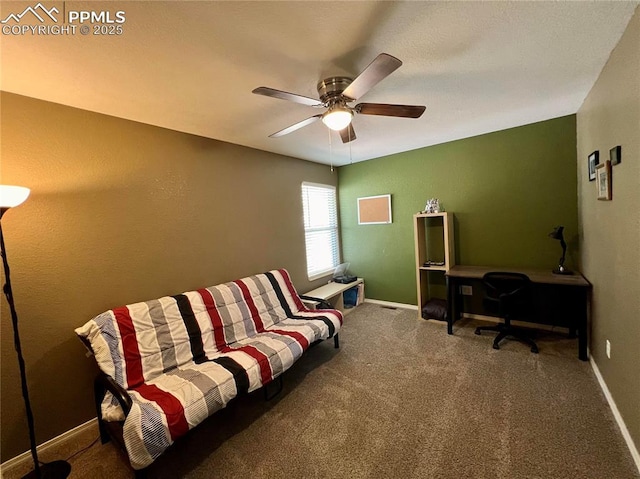 office area with carpet floors, baseboards, and a ceiling fan