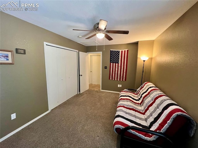 living area featuring a ceiling fan, baseboards, and carpet flooring