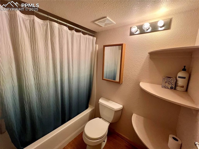 bathroom with shower / bath combo, visible vents, a textured wall, toilet, and a textured ceiling