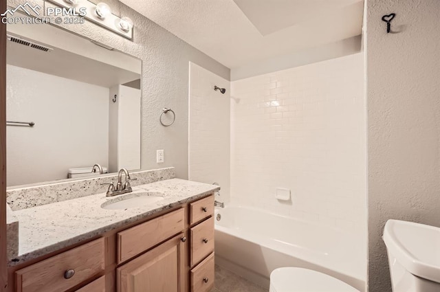 full bath with shower / bath combination, visible vents, a textured wall, and toilet