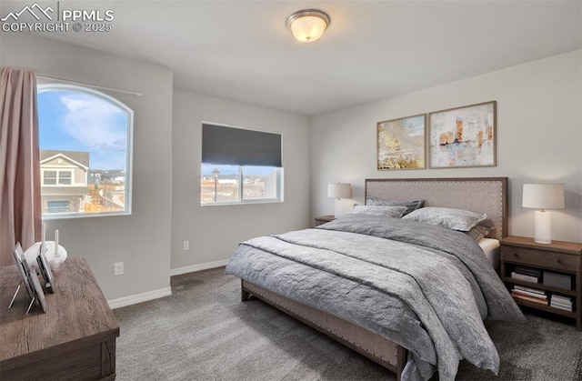 carpeted bedroom with baseboards