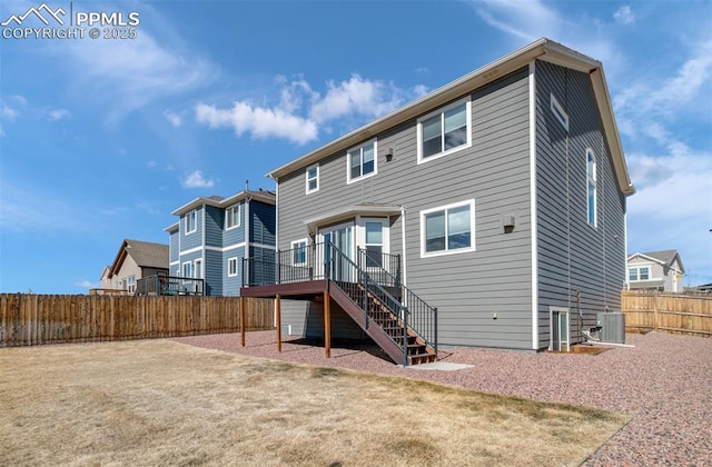 rear view of house with stairs, central AC, a fenced backyard, and a wooden deck