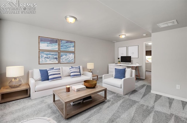 living area featuring light carpet, baseboards, and visible vents