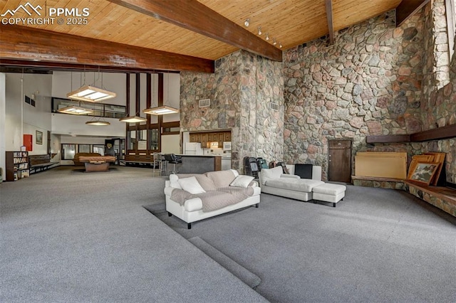 living room featuring a towering ceiling, wooden ceiling, and a fireplace