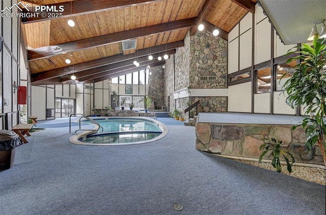 view of swimming pool featuring an indoor hot tub