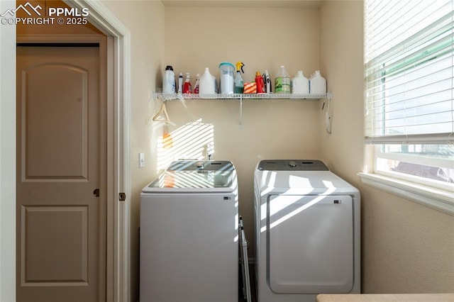 washroom with laundry area and independent washer and dryer