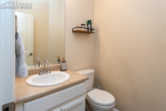 half bath with toilet and vanity