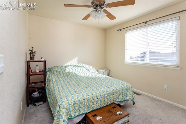 bedroom featuring ceiling fan, carpet, visible vents, and baseboards