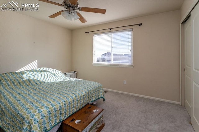 bedroom with ceiling fan, a closet, carpet, and baseboards