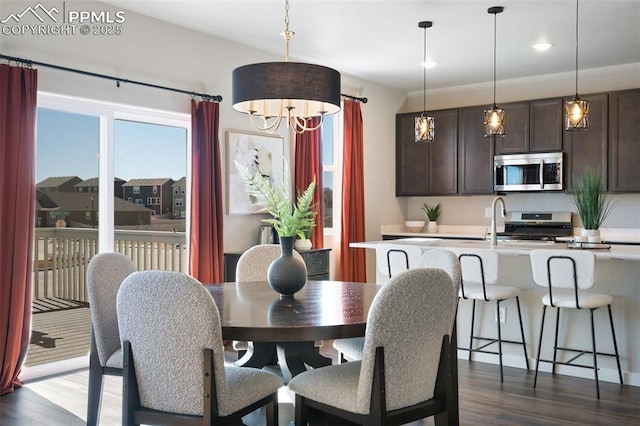 dining area featuring dark wood finished floors