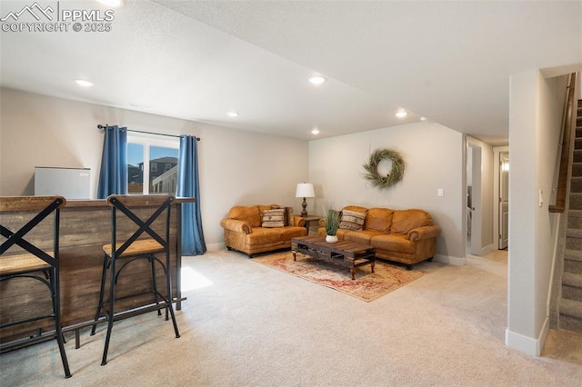 carpeted living area featuring stairs, baseboards, and recessed lighting