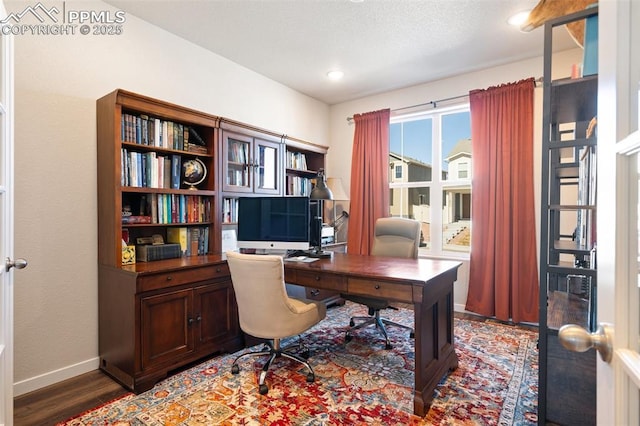 office space featuring recessed lighting, wood finished floors, and baseboards