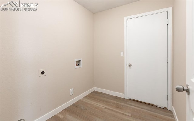 clothes washing area with light wood-style flooring, hookup for an electric dryer, laundry area, washer hookup, and baseboards