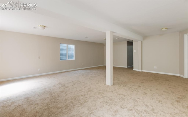 basement featuring carpet floors and baseboards