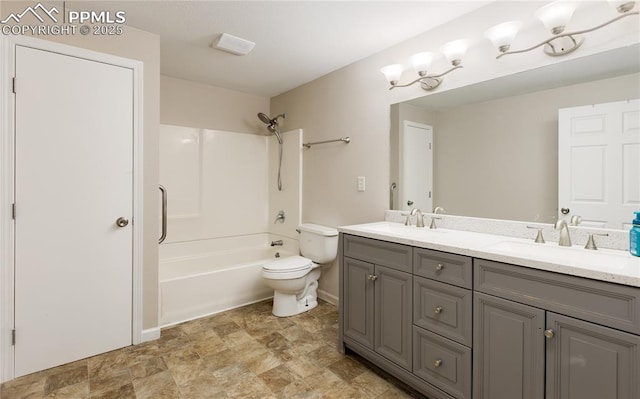 full bathroom with washtub / shower combination, a sink, toilet, and double vanity