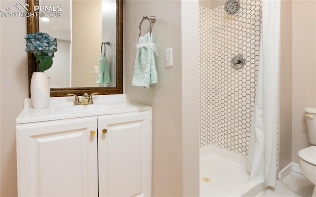 full bath with a shower stall, toilet, and vanity