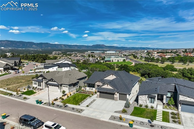 aerial view featuring a mountain view and a residential view