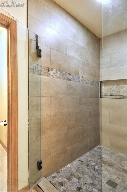 full bathroom with tiled shower