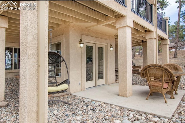 view of patio featuring a balcony