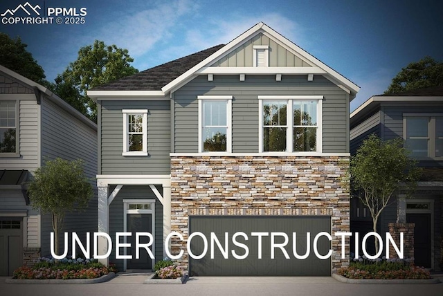 view of front of home featuring driveway, stone siding, a garage, and board and batten siding