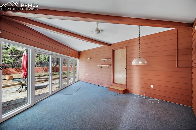 unfurnished sunroom featuring beamed ceiling