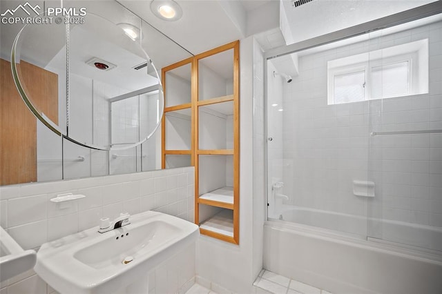 bathroom featuring shower / bath combination and a sink