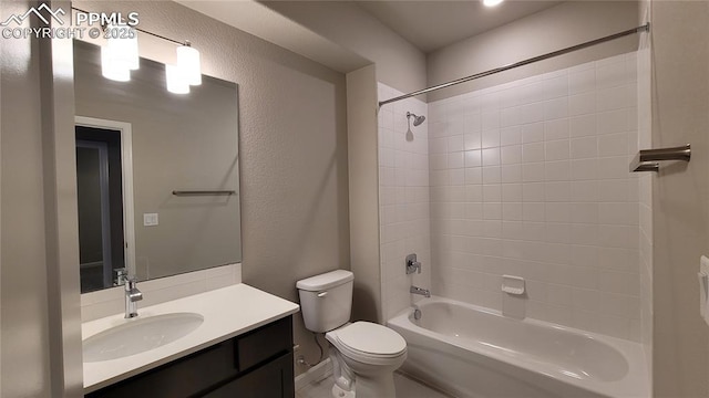 9455 Jollity Pt, Colorado Springs, CO 80924 - bathroom with toilet, shower / bath combination, vanity, and a textured wall