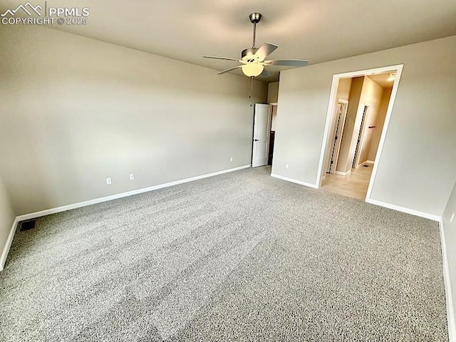 9455 Jollity Pt, Colorado Springs, CO 80924 - spare room featuring baseboards, ceiling fan, and light carpet