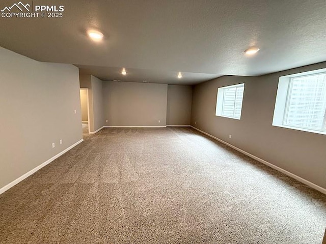9455 Jollity Pt, Colorado Springs, CO 80924 - below grade area featuring baseboards, carpet, a textured ceiling, and recessed lighting