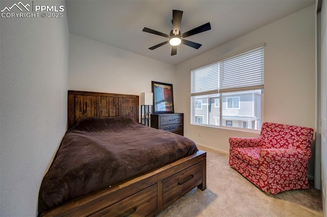 carpeted bedroom featuring ceiling fan and baseboards