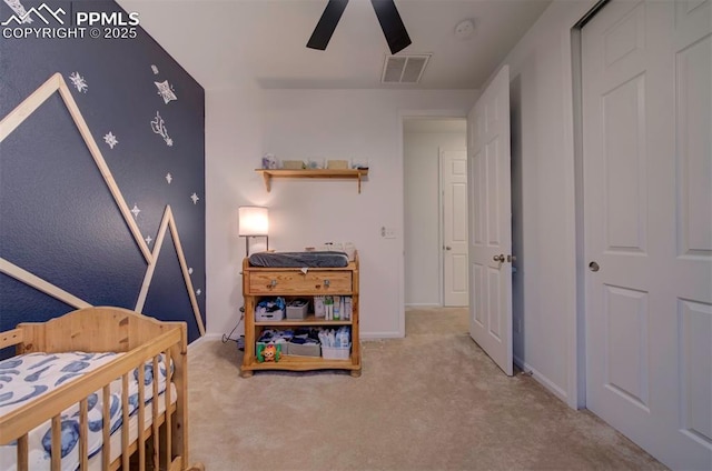 carpeted bedroom with ceiling fan, visible vents, and baseboards