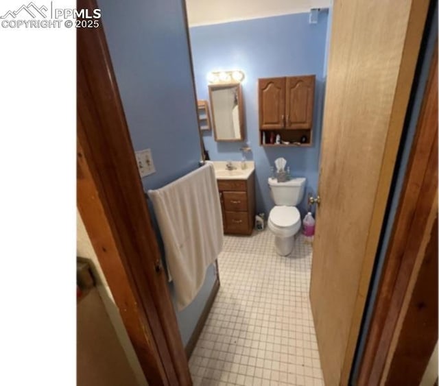 bathroom with toilet and vanity