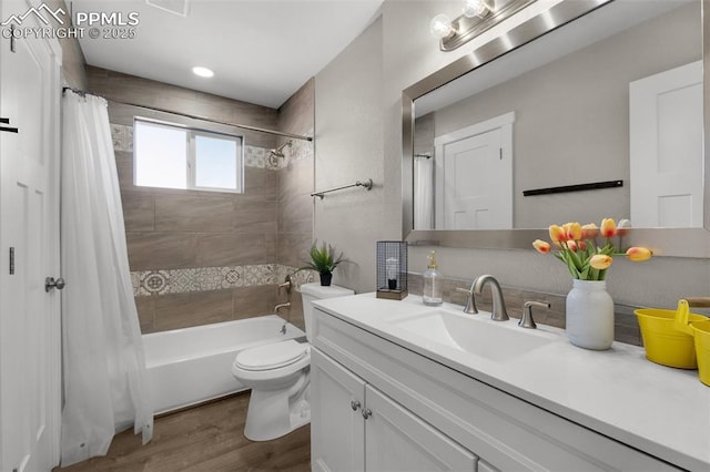 bathroom featuring vanity, shower / bathtub combination with curtain, toilet, and wood finished floors