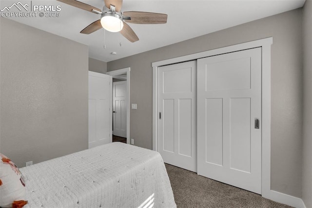 carpeted bedroom featuring a closet and ceiling fan