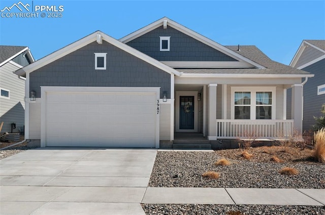 view of front of home featuring covered porch, concrete driveway, an attached garage, and a shingled roof